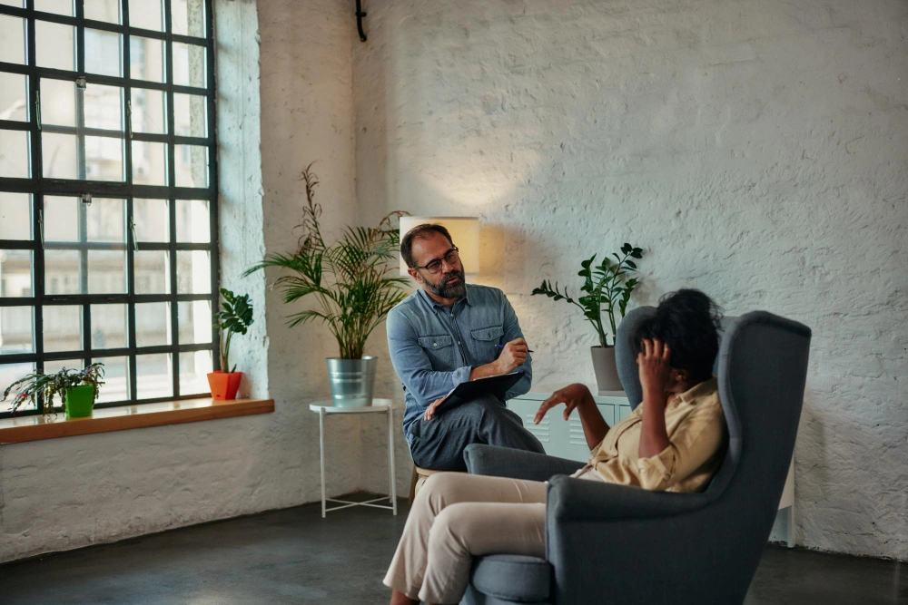 Caring counselor listening to female patient