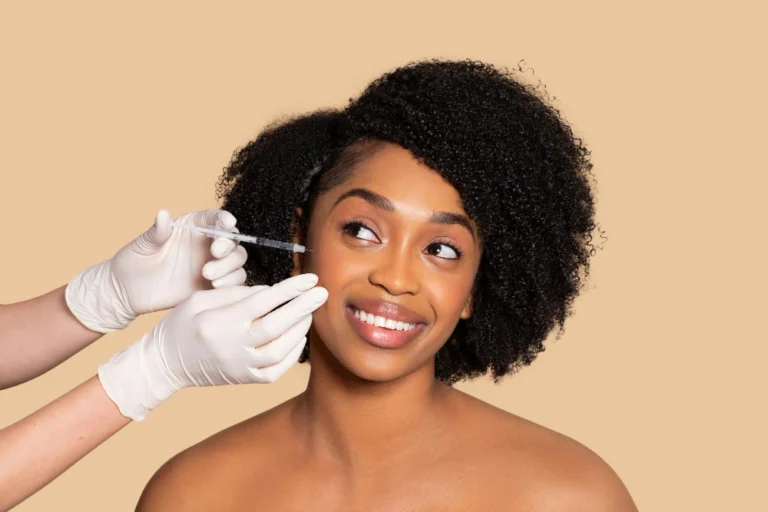 Brighteyed black woman gets Botox Injection