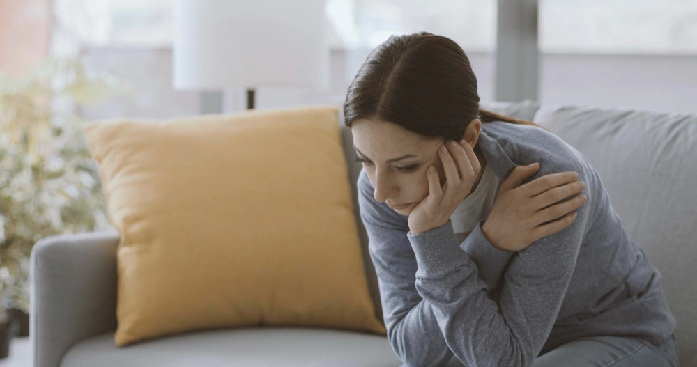 Sad Anxiety woman self isolating at home